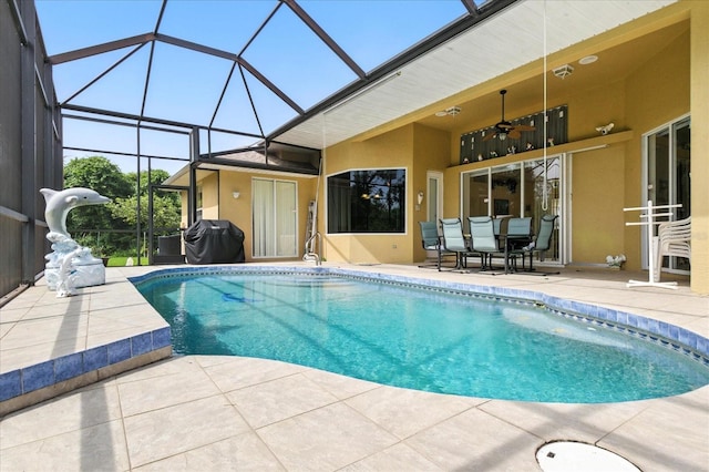 2329 Como St, Port Charlotte, FL 33948 - outdoor pool with a patio area, a ceiling fan, grilling area, glass enclosure, and outdoor dining area