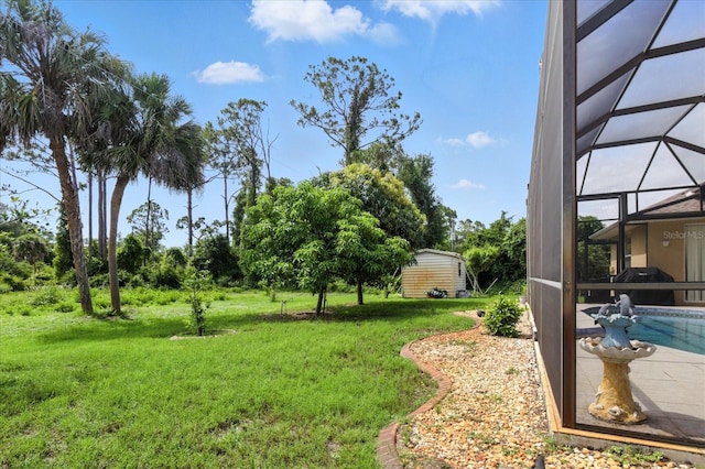 2329 Como St, Port Charlotte, FL 33948 - view of grassy yard featuring a storage shed, a lanai, and an outdoor pool