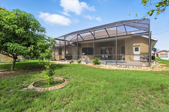 2329 Como St, Port Charlotte, FL 33948 - rear view of house with stucco siding, a lawn, a swimming pool, glass enclosure, and a patio area