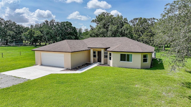 3993 NE Bobay Rd, Arcadia, FL 34266 - prairie-style house with driveway, stucco siding, a shingled roof, and a garage