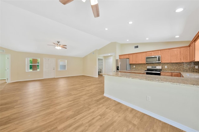 3993 NE Bobay Rd, Arcadia, FL 34266 - kitchen with appliances with stainless steel finishes, a ceiling fan, lofted ceiling, tasteful backsplash, and recessed lighting