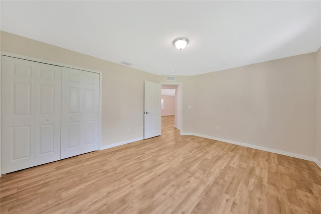3993 NE Bobay Rd, Arcadia, FL 34266 - unfurnished bedroom featuring light wood-style floors and a closet