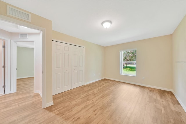 3993 NE Bobay Rd, Arcadia, FL 34266 - unfurnished bedroom featuring light wood finished floors and a closet
