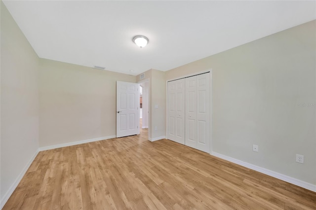 3993 NE Bobay Rd, Arcadia, FL 34266 - unfurnished bedroom with light wood finished floors and a closet