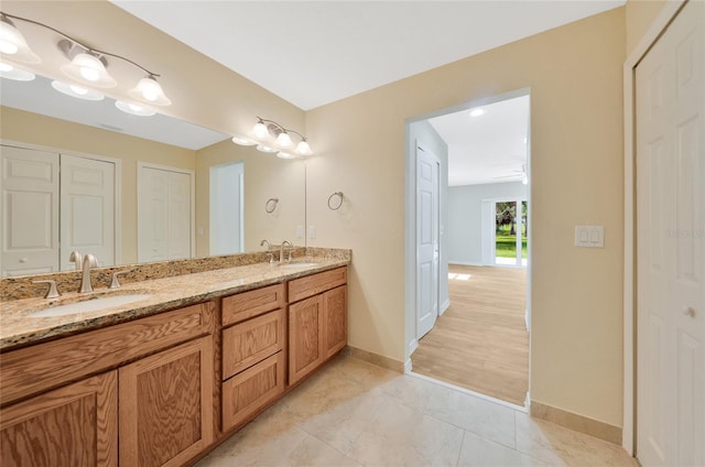 3993 NE Bobay Rd, Arcadia, FL 34266 - bathroom featuring a closet and double vanity