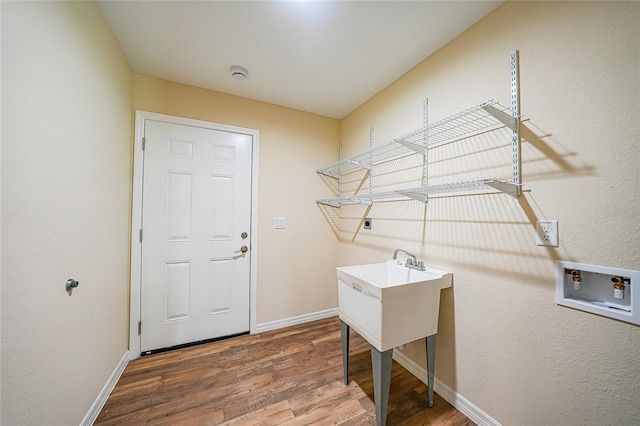 3993 NE Bobay Rd, Arcadia, FL 34266 - laundry area featuring hookup for a washing machine and wood finished floors