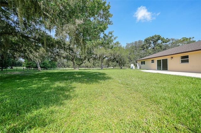 3993 NE Bobay Rd, Arcadia, FL 34266 - view of grassy yard with a patio area and view of scattered trees