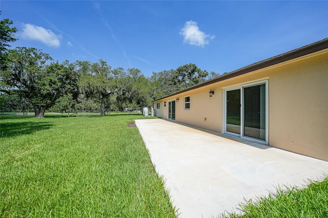 3993 NE Bobay Rd, Arcadia, FL 34266 - view of green lawn with a patio area