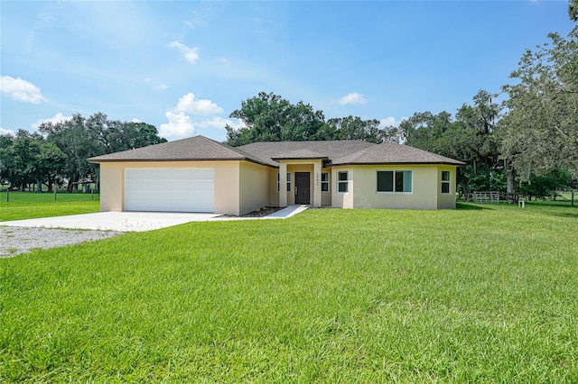 3993 NE Bobay Rd, Arcadia, FL 34266 - view of front facade featuring driveway, stucco siding, and an attached garage