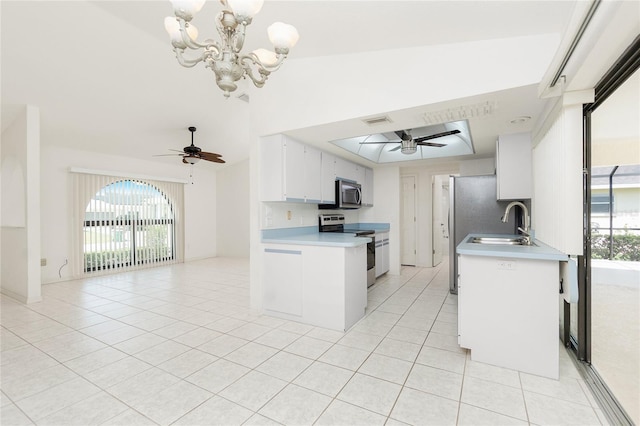 18147 Brazil Ave, Port Charlotte, FL 33948 - kitchen featuring appliances with stainless steel finishes, a ceiling fan, light tile patterned flooring, and open floor plan