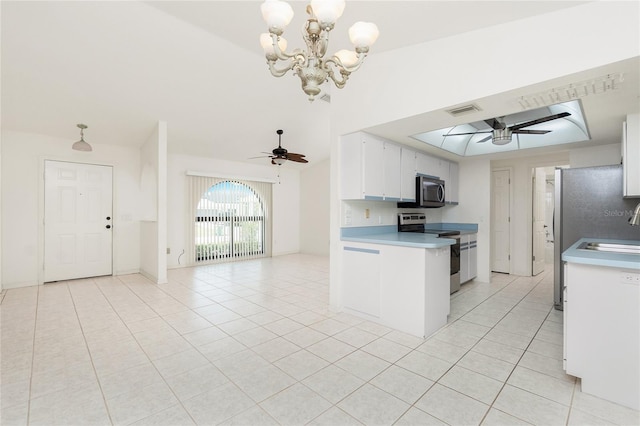 18147 Brazil Ave, Port Charlotte, FL 33948 - kitchen with appliances with stainless steel finishes, ceiling fan, light tile patterned floors, and white cabinetry