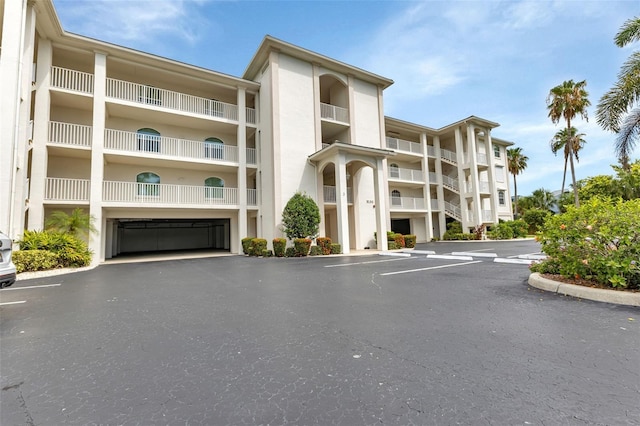 1250 W Marion Ave Unit 333, Punta Gorda, FL 33950 - view of apartment building / complex featuring uncovered parking