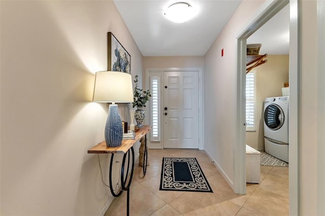 1250 W Marion Ave Unit 333, Punta Gorda, FL 33950 - entrance foyer with washer / dryer and light tile patterned flooring