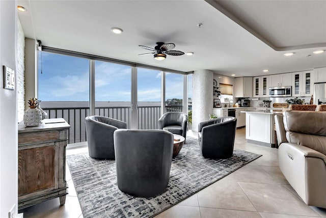 1250 W Marion Ave Unit 333, Punta Gorda, FL 33950 - living area with a ceiling fan, recessed lighting, a water view, healthy amount of natural light, and light tile patterned floors