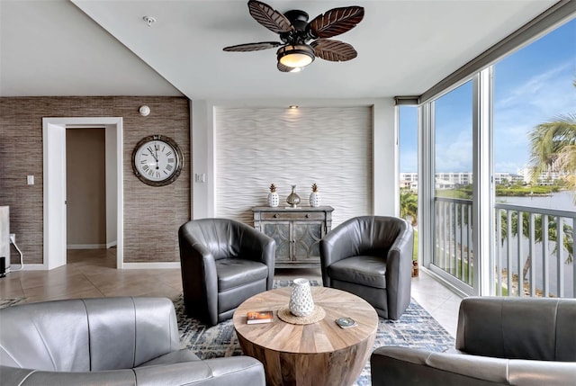 1250 W Marion Ave Unit 333, Punta Gorda, FL 33950 - living room featuring plenty of natural light, tile patterned flooring, ceiling fan, a water view, and expansive windows