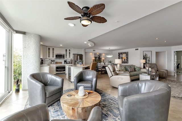 1250 W Marion Ave Unit 333, Punta Gorda, FL 33950 - living room with light tile patterned floors, ceiling fan, and recessed lighting