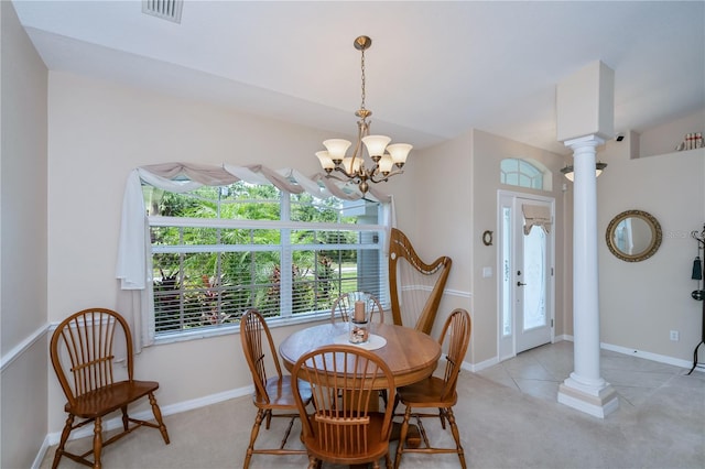 3824 Dominic St, North Port, FL 34288 - dining room with decorative columns, a chandelier, and light carpet