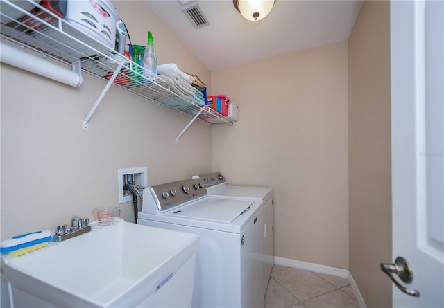 3824 Dominic St, North Port, FL 34288 - washroom featuring independent washer and dryer and light tile patterned floors