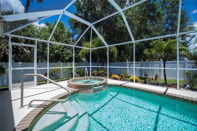 3824 Dominic St, North Port, FL 34288 - view of pool with a fenced backyard, a pool with connected hot tub, glass enclosure, and a patio area