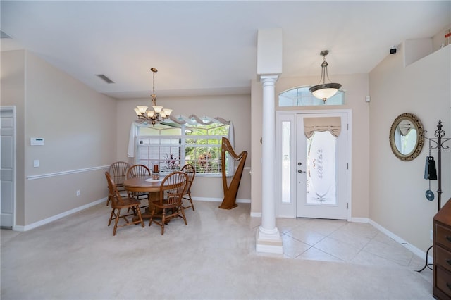 3824 Dominic St, North Port, FL 34288 - entrance foyer with a chandelier, decorative columns, and light carpet