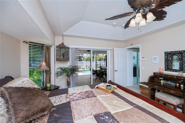 3824 Dominic St, North Port, FL 34288 - bedroom with access to exterior, a raised ceiling, and ceiling fan