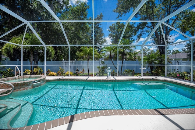 3824 Dominic St, North Port, FL 34288 - view of pool with a fenced backyard, glass enclosure, and a pool with connected hot tub