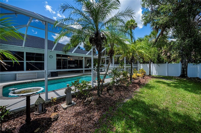 3824 Dominic St, North Port, FL 34288 - view of swimming pool featuring glass enclosure, ceiling fan, and a patio area