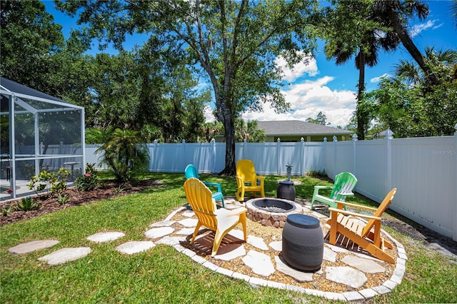 3824 Dominic St, North Port, FL 34288 - fenced backyard with an outdoor fire pit and a lanai