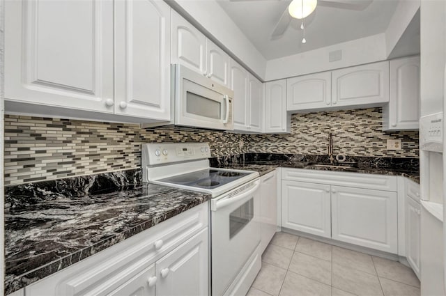 2437 Harbor Blvd Unit 114, Port Charlotte, FL 33952 - kitchen featuring white appliances, a ceiling fan, white cabinets, light tile patterned floors, and decorative backsplash
