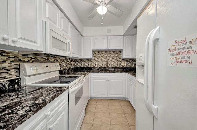 2437 Harbor Blvd Unit 114, Port Charlotte, FL 33952 - kitchen featuring white appliances, white cabinetry, tasteful backsplash, and a ceiling fan