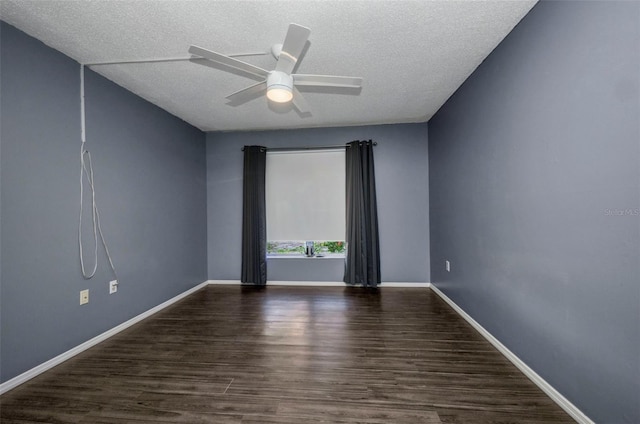 2437 Harbor Blvd Unit 114, Port Charlotte, FL 33952 - empty room featuring dark wood finished floors, a ceiling fan, and a textured ceiling