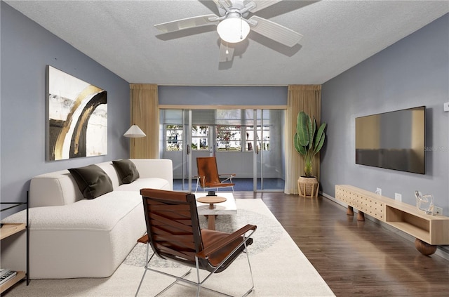 2437 Harbor Blvd Unit 114, Port Charlotte, FL 33952 - living room with wood finished floors, a ceiling fan, and a textured ceiling