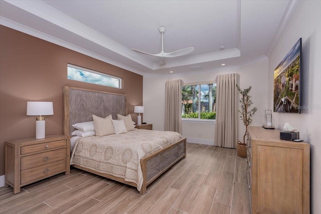 3800 Carupano Ct, Punta Gorda, FL 33950 - bedroom with a tray ceiling, crown molding, light wood-style floors, recessed lighting, and a ceiling fan