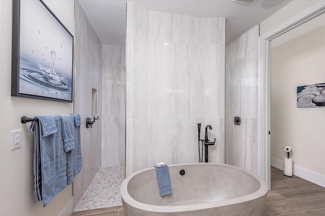 3800 Carupano Ct, Punta Gorda, FL 33950 - full bath featuring a freestanding tub, a walk in shower, and wood finished floors