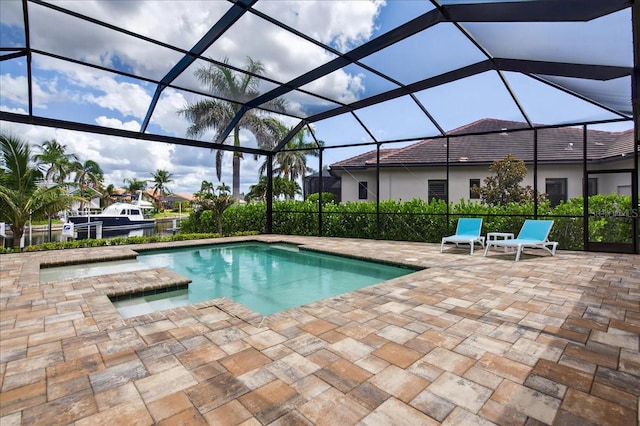 3800 Carupano Ct, Punta Gorda, FL 33950 - outdoor pool featuring a patio area and glass enclosure