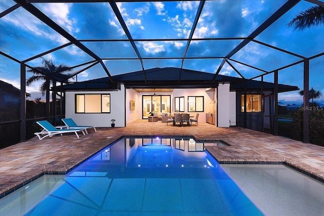 3800 Carupano Ct, Punta Gorda, FL 33950 - back of property featuring a patio area, an outdoor pool, and glass enclosure
