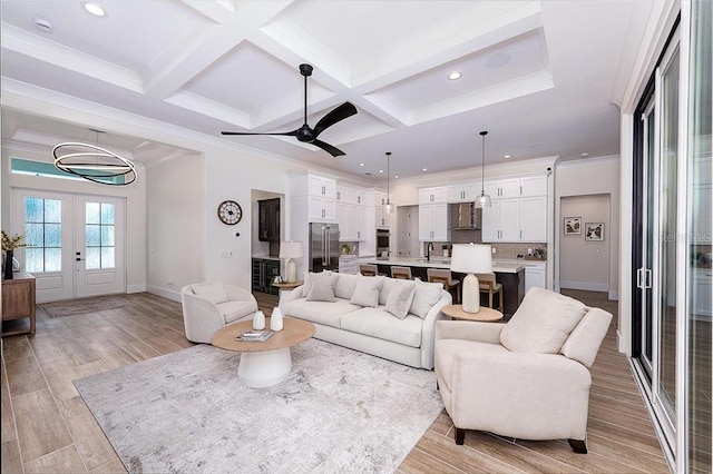 3800 Carupano Ct, Punta Gorda, FL 33950 - living area with french doors, recessed lighting, beamed ceiling, coffered ceiling, and ceiling fan