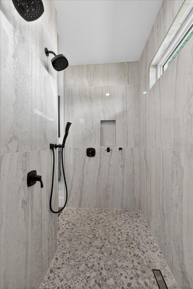 3800 Carupano Ct, Punta Gorda, FL 33950 - bathroom featuring a marble finish shower