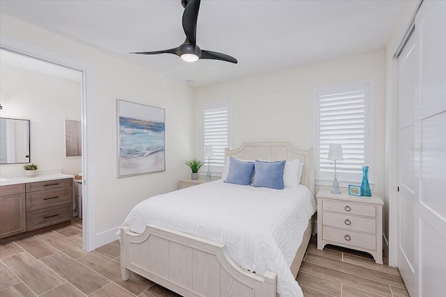 3800 Carupano Ct, Punta Gorda, FL 33950 - bedroom featuring wood finish floors, ensuite bathroom, a ceiling fan, and a closet