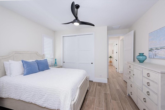3800 Carupano Ct, Punta Gorda, FL 33950 - bedroom featuring wood finished floors, a closet, and a ceiling fan