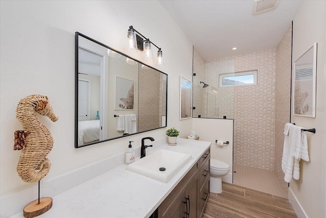 3800 Carupano Ct, Punta Gorda, FL 33950 - bathroom featuring a walk in shower, vanity, and wood finished floors