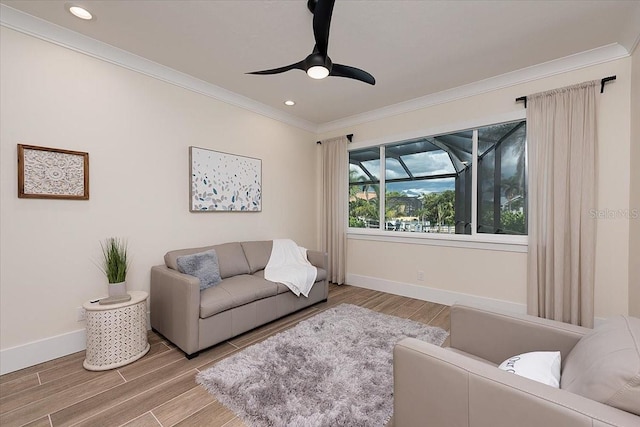 3800 Carupano Ct, Punta Gorda, FL 33950 - living area featuring ornamental molding, a ceiling fan, wood finished floors, and recessed lighting