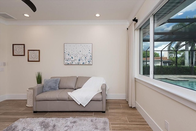 3800 Carupano Ct, Punta Gorda, FL 33950 - living area with ornamental molding, wood finished floors, and recessed lighting