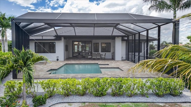 3800 Carupano Ct, Punta Gorda, FL 33950 - back of house with a patio, stucco siding, glass enclosure, and an outdoor pool