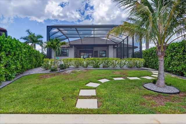 3800 Carupano Ct, Punta Gorda, FL 33950 - back of house featuring a lawn, stucco siding, and a lanai