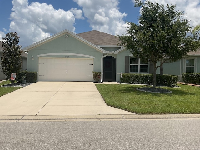 25228 E Lenox Cir, Punta Gorda, FL 33950 - ranch-style home with a front lawn, concrete driveway, an attached garage, and stucco siding
