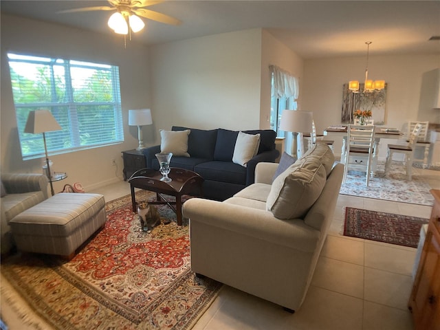 25228 E Lenox Cir, Punta Gorda, FL 33950 - tiled living area featuring a chandelier and ceiling fan