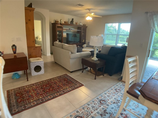 25228 E Lenox Cir, Punta Gorda, FL 33950 - living area with ceiling fan, tile patterned floors, and arched walkways