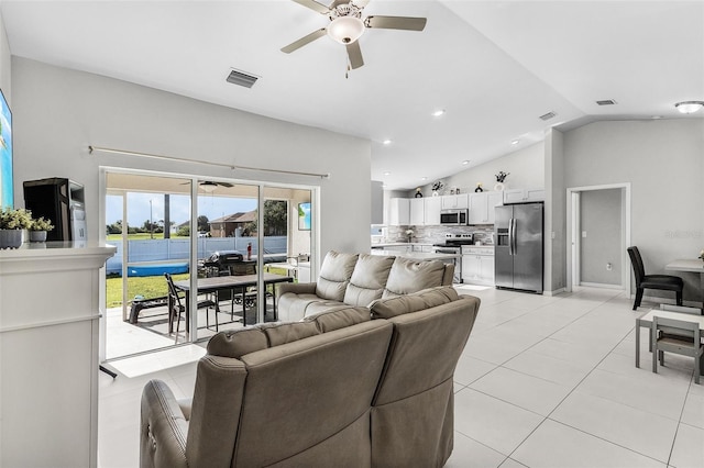 1731 NW 24th Pl, Cape Coral, FL 33993 - living area with a ceiling fan, lofted ceiling, light tile patterned floors, recessed lighting, and a water view