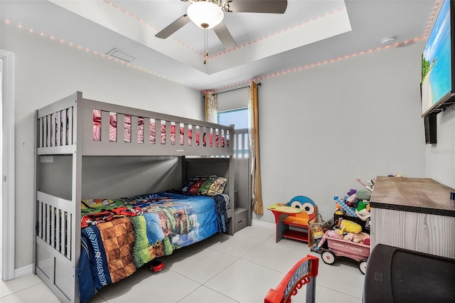 1731 NW 24th Pl, Cape Coral, FL 33993 - bedroom featuring tile patterned flooring, a tray ceiling, and ceiling fan
